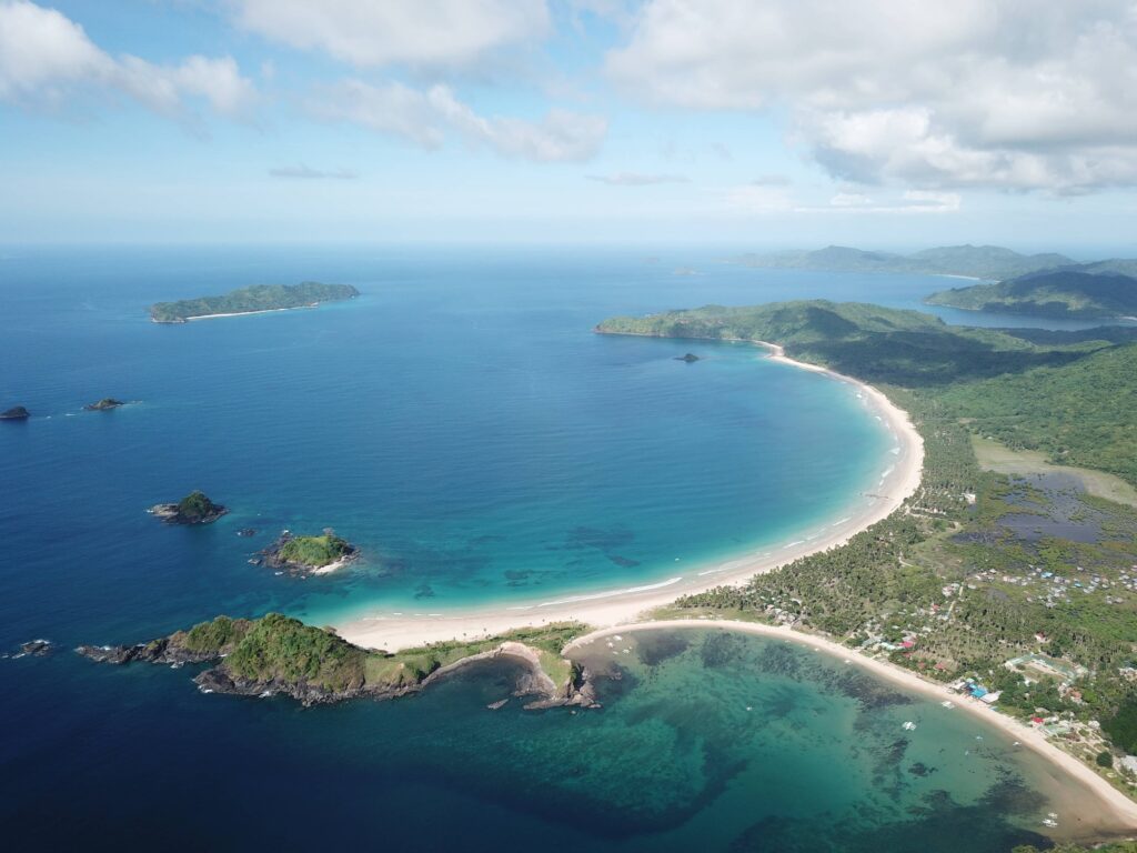 A long, curved sandy beach and turquoise waters, answering the question is El Nido, Palawan, worth visiting.